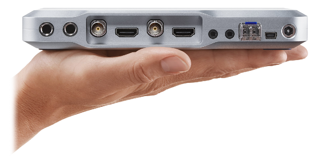 Hand holding the ATEM Camera Converter showing the rear view, Blackmagic Design ATEM Studio Converter 2